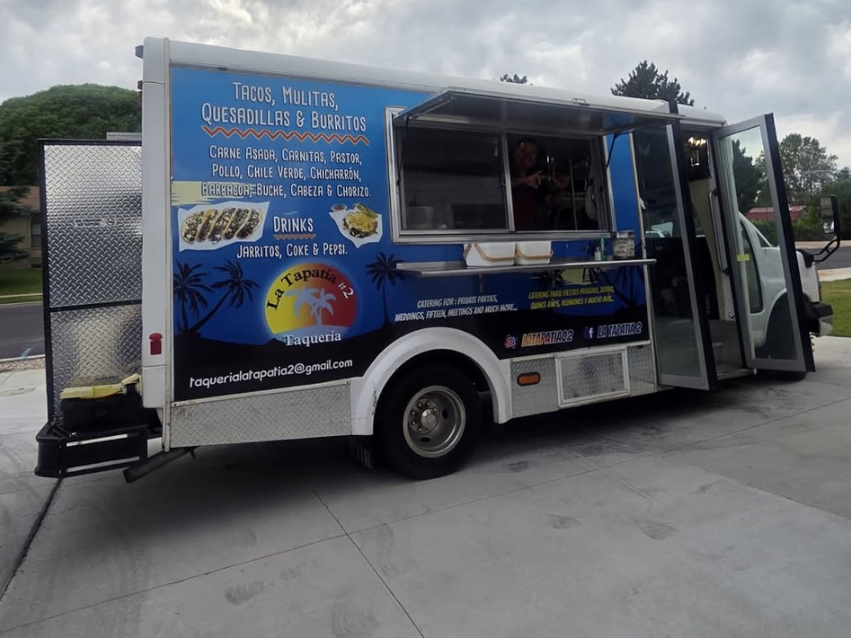 The La Tapatía #2 truck with its blue wrap and the serving window open