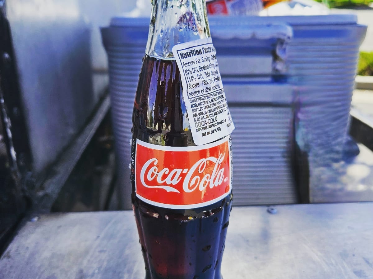 A glass bottle of Mexican Coca-Cola on the truck counter