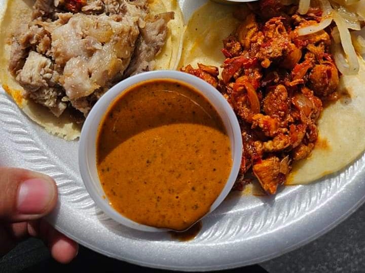 Tacos with salsa verde, salsa roja, grilled onions and a roasted chile