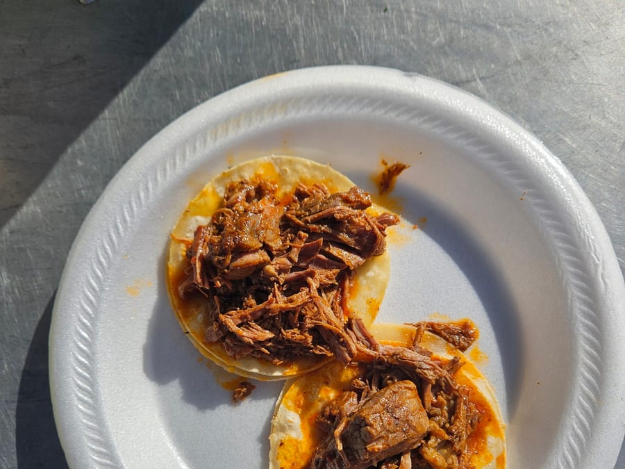 Two barbacoa tacos at the truck window